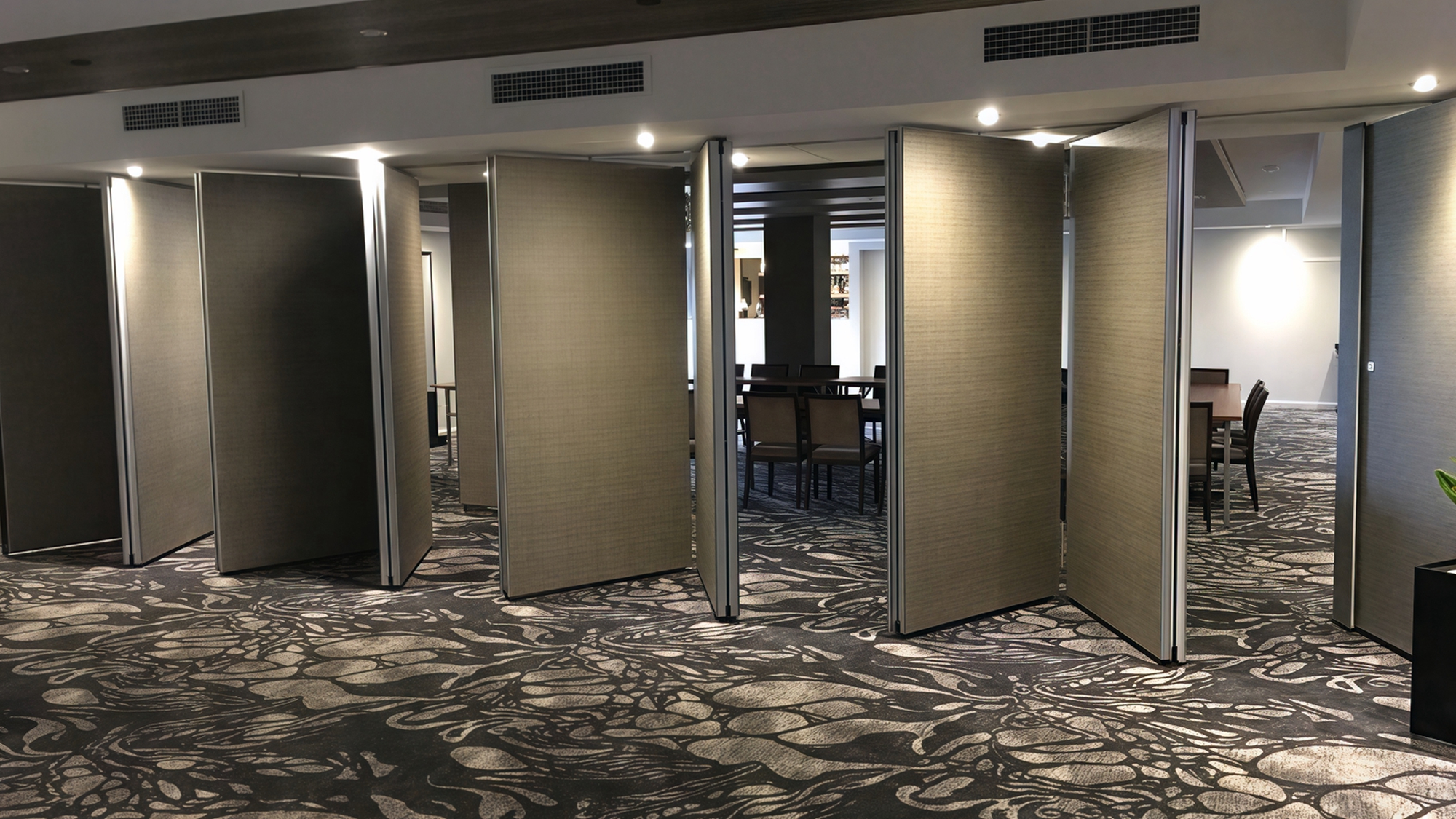 Folding operable partitions in a hotel ballroom